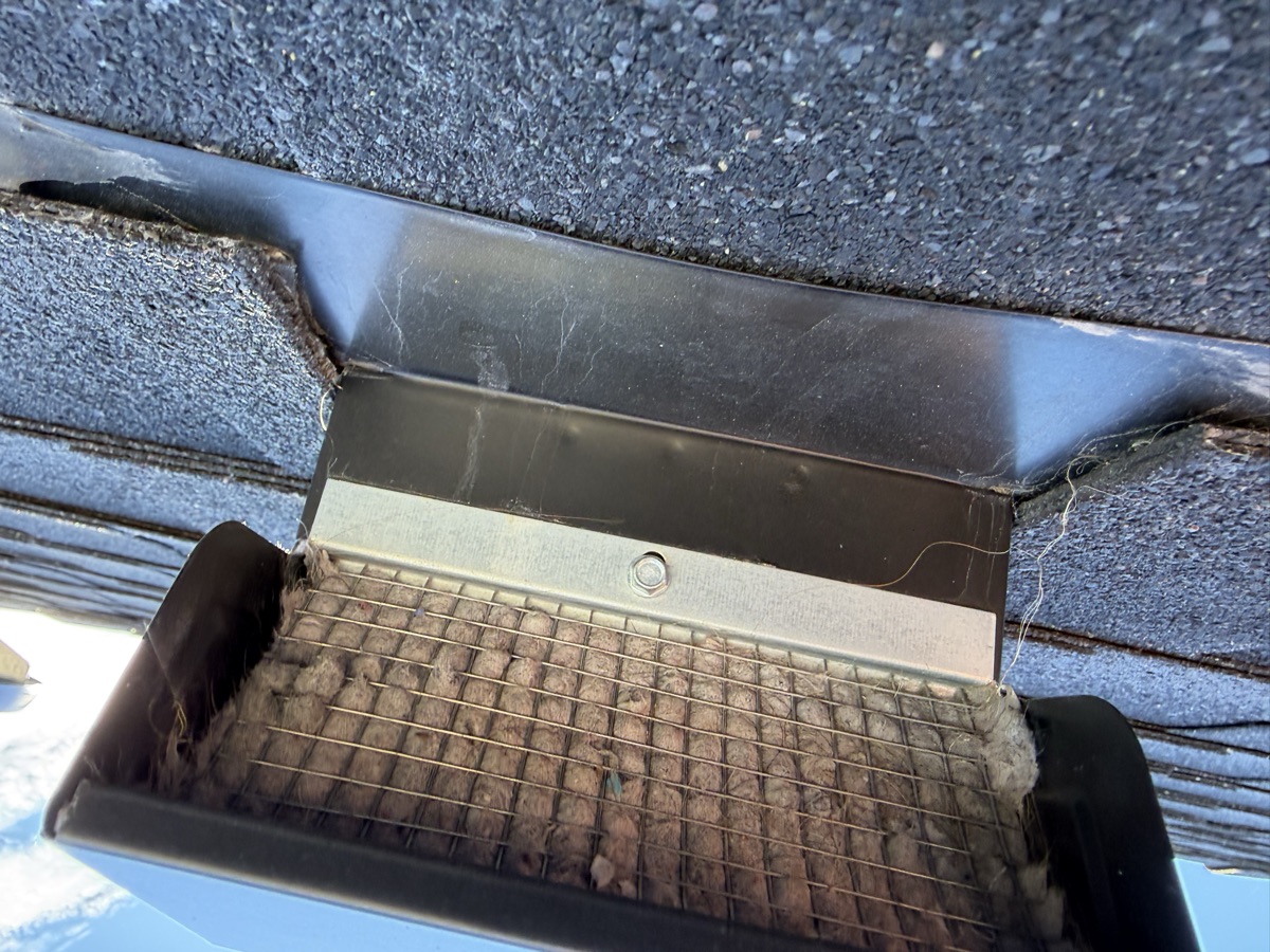Roof dryer vent with lint buildup