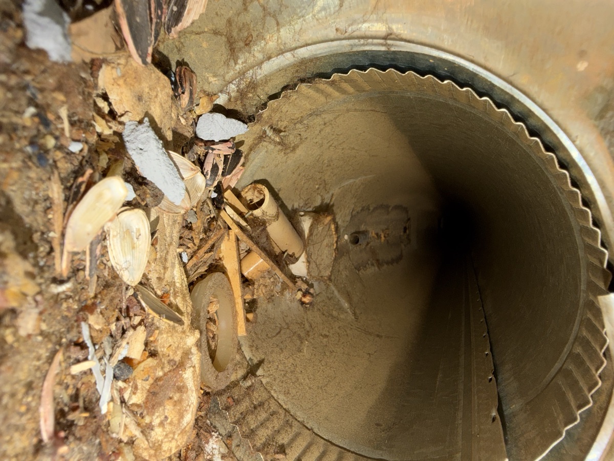 Construction debris and leaves in duct